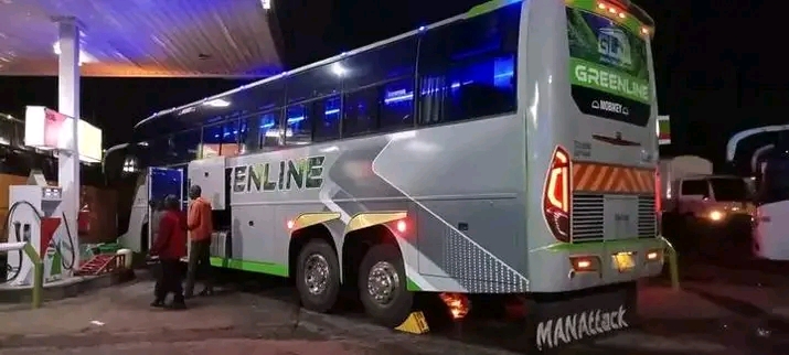 Greenline Royal Mobikey coach at a lit fuel station