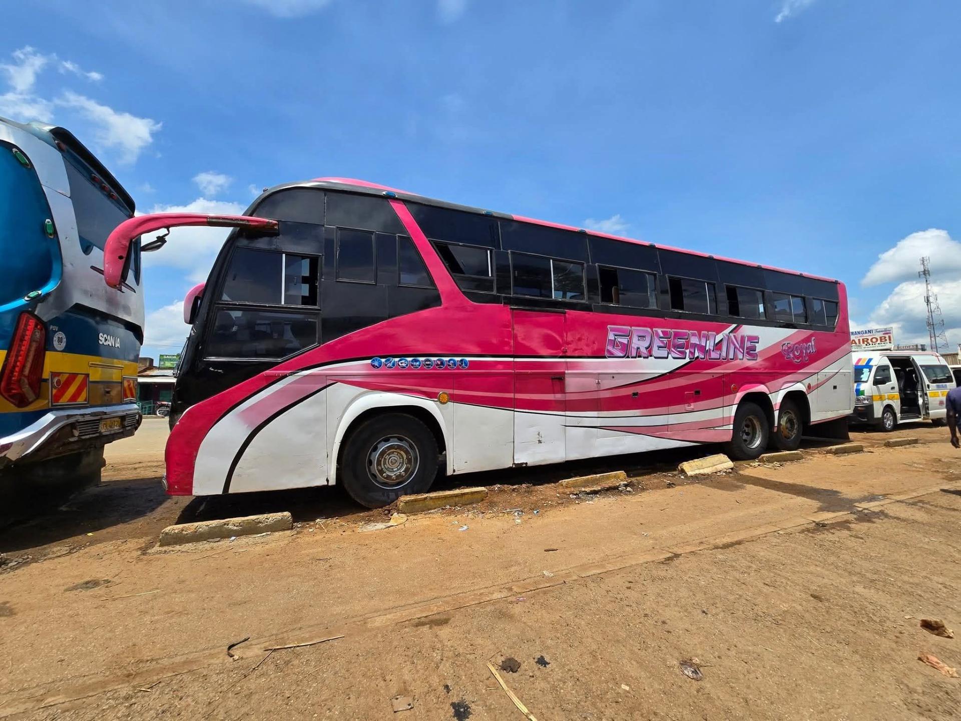 Greenline Royal double-decker coach in pink and white livery